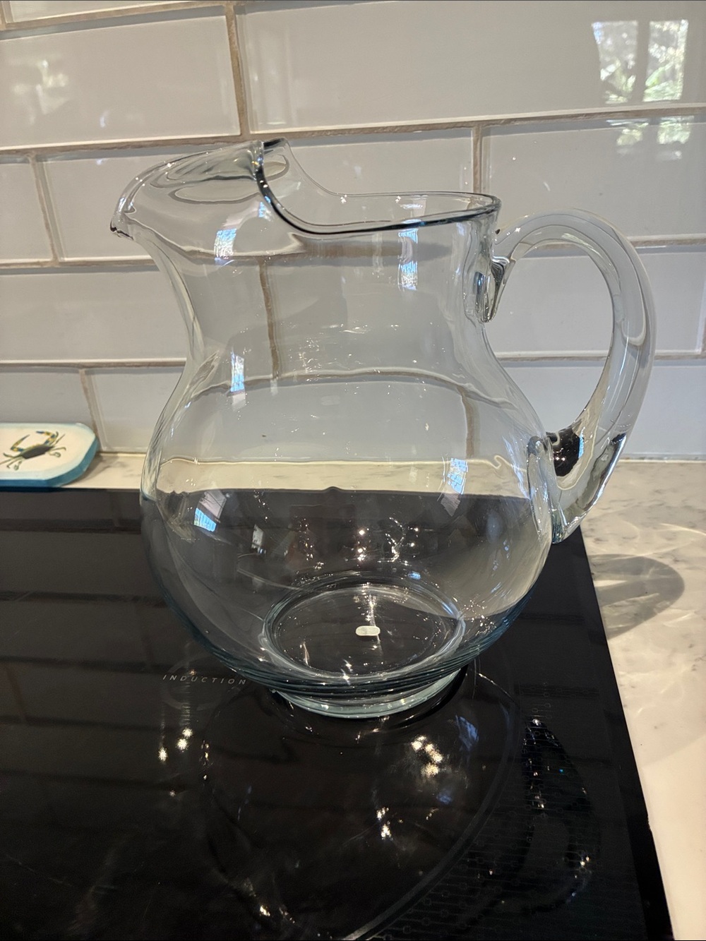 Mexican hand blown glass pitcher 8 inches high 8 inch diameter